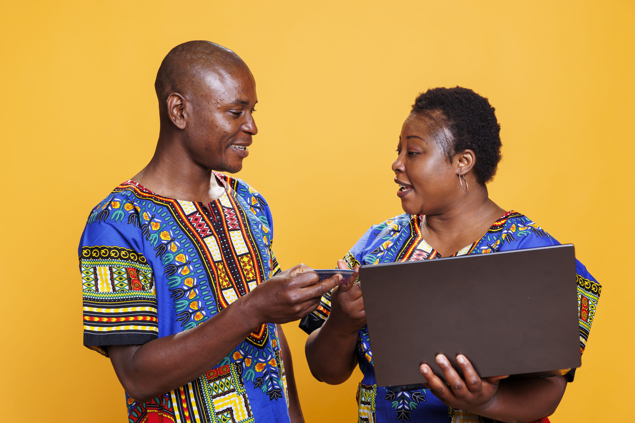 Woman taking credit card from man